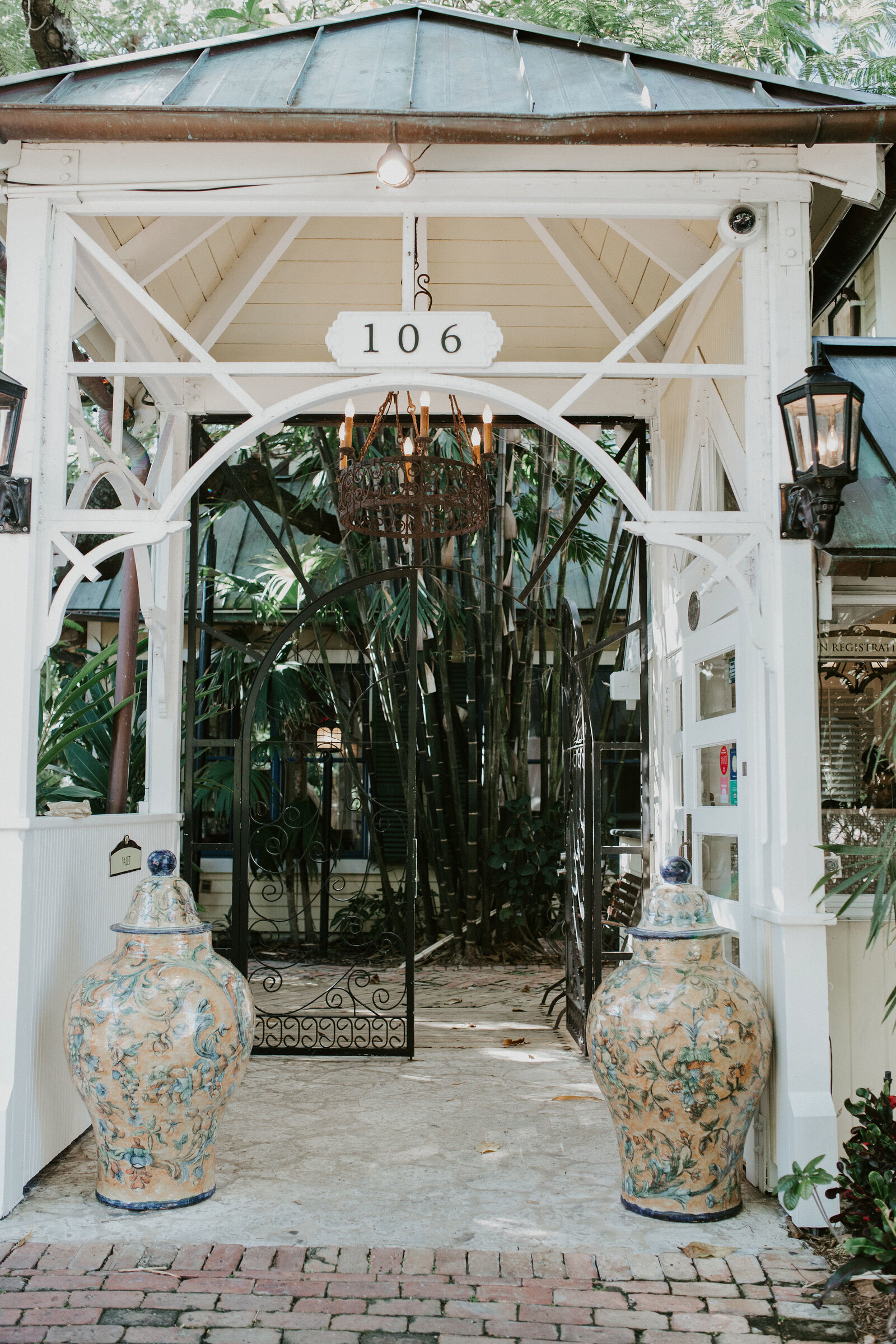 White garden gazebo entrance styled for an intimate wedding ceremony